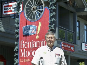 he Hub owner Stan Rutkauskas outside his hardware store in Beaconsfield, west of Montreal Thursday June 6, 2019.  Rutkauskas was ordered by Beaconsfield to remove several signs from outside his store, one of which has been in place since the business started over 70 years ago.