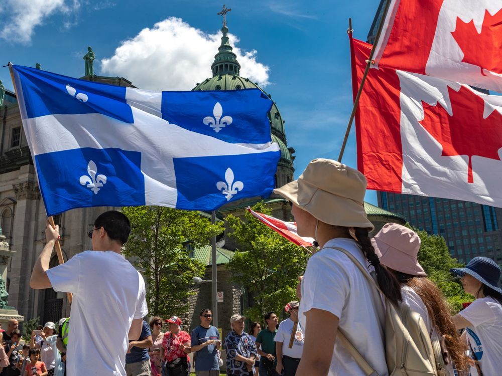 Montrealers take part in the Canada Day Parade in Montreal on Monday July 1, 2019. 