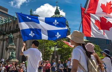 Montrealers take part in the Canada Day Parade in Montreal on Monday July 1, 2019.