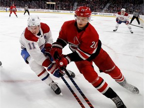 Hurricanes' Sebastian Aho, right, battles Canadiens' Brendan Gallagher for the puck in the corner during a game last December at the Bell Centre.