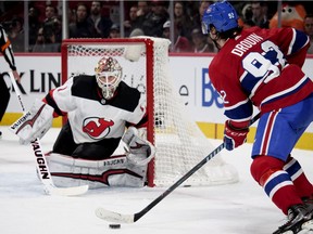 New Jersey Devils goalie Keith Kinkaid gets set for shot from the Canadiens' Jonathan Drouin during NHL game at the Bell Centre in Montreal on April 1, 2018.