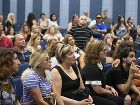 Concerned parents listen during a town hall meeting from the English Montreal School Board (EMSB) in Montreal, Quebec July 2,  2019.
