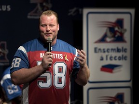 Alouettes offensive-lineman Luc Brodeur-Jourdain speaks to students at Antoine-de-Saint-Exupery School in Montreal on Feb. 15, 2018.