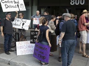 A small group of social housing protesters make themselves heard in front of the Ville-Marie borough office before a council meeting on Wednesday.