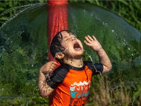 2-year-old Andrew is enjoying the water park at Martin Luther King Park (aka Kent Park) pool/water park in Montreal July 4, 2019.