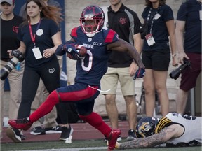 Montreal Alouettes kick-returner Stefan Logan runs away from Hamilton Tiger-Cats' Connor McGough in Montreal on July 4, 2019.