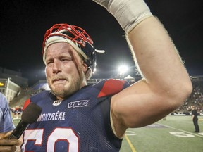 Luc Brodeur-Jourdain is overcome with emotion while addressing the fans following his final  CFL game, in Montreal Thursday, July 4, 2019.