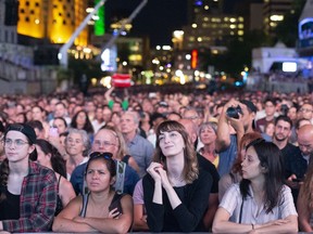 Crowds watch as Matt Holubowski performs during the closing blowout of the 40th Montreal International Jazz Festival in Montreal, Quebec July 6, 2019.