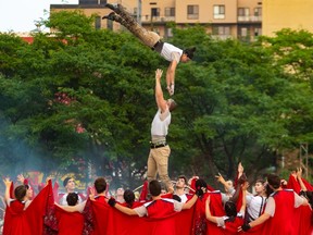 Acrobats took to the air at the signature free show, Candide, at Jardins Gamelin in Montreal on Tuesday July 9, 2019.