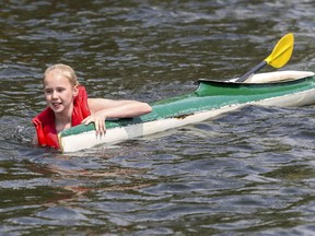 Maxime Larin swims her kayak back to the dock at the Lachine Racing Canoe Club on Tuesday July 9, 2019.  She was taking part in a training exercise to learn what to do when her boat tips.