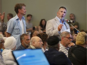 Pierrefonds-Roxboro Mayor Jim Beis speaks during public consultations concerning the new flood-zone map by the Quebec government in Pointe-Claire on Thursday.