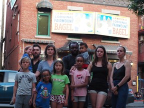 Mile End residents Alexis Chartrand, Véronique Trottier, Maxime Roy, Dominique Charbonneau and their children are concerned about health effects of breathing smoke from wood-burning bagel bakeries.