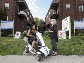 Felicia Tremblay de la Guardia, right, speaks with neighbour Marie Pontini outside their Hampstead apartment buildings in Montreal.