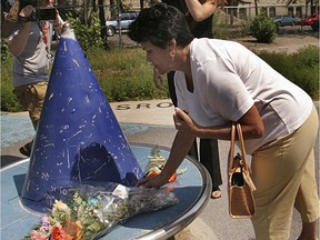 Michelle Laforest, whose son was killed in the biker war, attends a memorial for 11-year-old Daniel Desrochers in 2005.