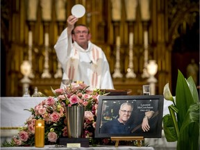 Fr. Philippe Morinat celebrates the funeral mass of pioneering LGBTQ activist Laurent McCutcheon at Saint-Pierre- Apôtre Church in Montreal on Saturday July 13, 2019.