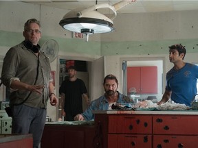 Director Michael Dowse (left), director of photography Bobby Shore and actors Dave Bautista and Kumail Nanjiani (wearing a St-Viateur Bagel T-shirt) on the set of Stuber.