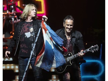 MONTREAL, QUE.: JULY 17, 2019 --   Def Leppard lead singer Joe Elliott, left, and Vivian Campbell perform in concert during show at the Bell Centre in Montreal on Wednesday July 17, 2019. (Pierre Obendrauf / MONTREAL GAZETTE) ORG XMIT: 62852 - 2713