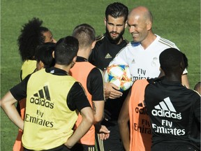 Real Madrid CF head coach Zinedine Zidane has a laugh with his players as the soccer team practised at Saputo stadium in Montreal July 17, 2019.