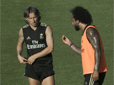 MONTREAL, QUE.: JULY 17, 2019 -- Real Madrid CF midfielder Luka Modric (left) listens to defender Marcelo as the soccer team practiced at Saputo stadium in Montreal July 17, 2019. The storied Spanish team is practicing in Montreal from July 9-19 in preparation for the International Champions Cup. (John Kenney / MONTREAL GAZETTE) ORG XMIT: 62866