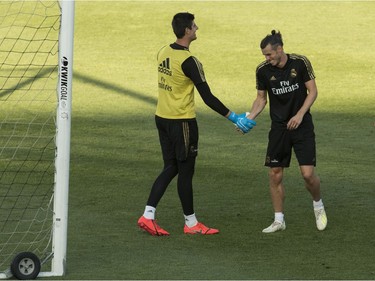 MONTREAL, QUE.: JULY 17, 2019 -- Real Madrid CF winger Gareth Bale (right) and goaltender Thibaut Courtois have a laugh as the team practiced at Saputo stadium in Montreal July 17, 2019. The storied Spanish team is practicing in Montreal from July 9-19 in preparation for the International Champions Cup. (John Kenney / MONTREAL GAZETTE) ORG XMIT: 62866