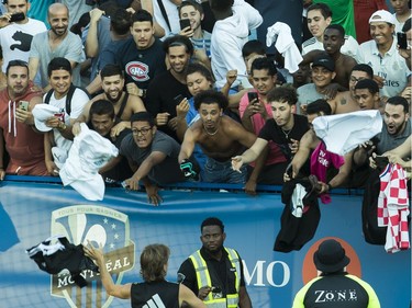 MONTREAL, QUE.: JULY 17, 2019 -- Fans throw jerseys towards Real Madrid CF player Luka Modric to autograph after the team practiced at Saputo stadium in Montreal July 17, 2019. The storied Spanish team is practicing in Montreal from July 9-19 in preparation for the International Champions Cup. (John Kenney / MONTREAL GAZETTE) ORG XMIT: 62866