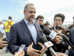 Montreal executive committee chairperson Benoit Dorais makes a statment apologizing for a recent speeding ticket where he was caught driving 171 kilometres per hour.  Dorias spoke following a press conference and ground-breaking for construction of the REM station at Trudeau Airport in Dorval, west of Montreal Friday July 19, 2019.