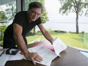 Homeowner Jacques Duval is seen in his home office, which overlooks Lac St-Louis in Beaconsfield, on Monday, July 22, 2019. Duval is one of more than 100 Beaconsfield residents who inexplicably find their properties on a map that shows they are at risk of flooding.