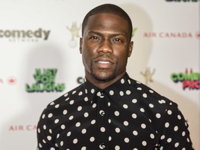 Actor and comedian Kevin Hart poses for photographs during the red carpet arrival for the Just For Laughs Awards in Montreal on Friday, July 24, 2015.