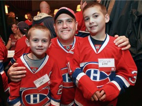 Eric Zeigenfuss brought his sons — Luke and Ryan — from Philadelphia for the annual HI/O Summit in Montreal on Oct. 26, 2013 to watch game between the Canadiens and San Jose Sharks at the Bell Centre.