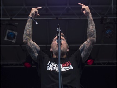 John Joseph of the band Cro-Mags has a salute for Donald Trump at the '77 Montréal punk festival at Parc Jean-Drapeau in Montreal on Friday, July 26, 2019.