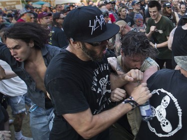 It was physical in the mosh pit as the band Cro-Mags perform at at the '77 Montréal punk festival at Parc Jean-Drapeau in Montreal on Friday, July 26, 2019.