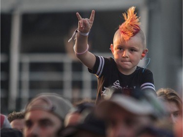 Lars Stevens enjoys the band Pennywise as they perform at the '77 Montréal punk festival at Parc Jean-Drapeau in Montreal on Friday, July 26, 2019.
