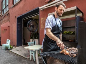 Phillip Andrews mans the outdoor grill at Parasol Bar à Vin on St-Laurent Blvd.