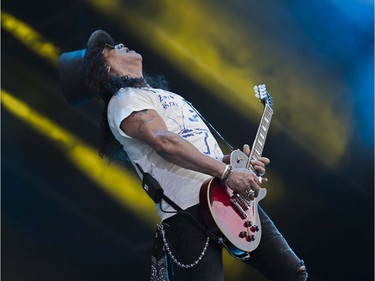 Guitarist Slash with the band Slash featuring Myles Kennedy and the Conspirators plays.