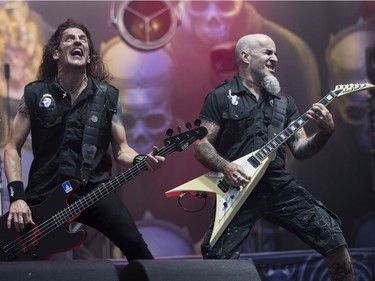Bassist Frank Bello (left) and guitarist Ian Scott of Anthrax play the Heavy Montréal metal festival July 28, 2019.