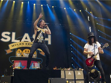 Slash (right) and Myles Kennedy, with the Conspirators, perform at the Heavy Montréal metal festival July 28, 2019.