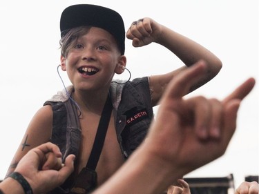 A youngster enjoys the music of  Slash featuring Myles Kennedy and the Conspirators.