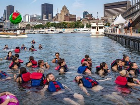 Montrealers took to Quai Jacques-Cartier for the annual Big Splash 2019 on Tuesday July 30, 2019. Initially organized by Montreal Baignade to prove that the St-Lawrence River was safe enough to swim in, participants now don life wests to take a quick dip in the river as an annual rite of summer. Dave Sidaway / Montreal Gazette