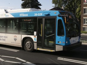 An STM hybrid bus makes it's way along St-Michel on Wednesday July 31, 2019. Montreal's hybrid buses are not achieving the savings that had been originally promised.