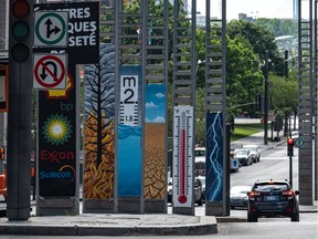 Greenpeace was behind the installation by Montreal artist Roadsworth on Robert-Bourassa Blvd. between Viger and la Gauchetiere Sts. on Wednesday July 31, 2019.