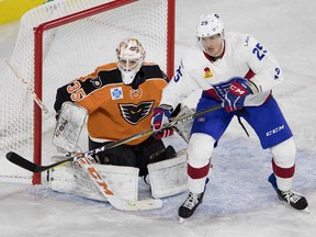 Laval Rocket center Michael McCarron looks to tip the puck past ehigh Valley Phantoms goalie Dustin Tokarski during AHL action in Montreal on Friday November 17, 2017.