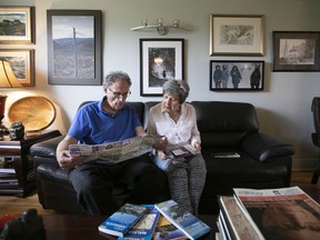 Planning their future getaway vacation, Elaine Kalman Naves and Archie Fineberg sit in the living room of their N.D.G home.