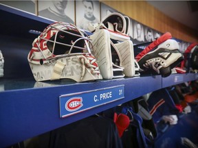 Canadiens goalie Carey Price's mask and gloves sit above his stall in the dressing room at the Bell Sports Complex in Brossard on April 9, 2019 after the team missed the NHL playoffs for the second straight season.