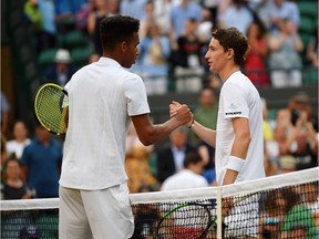 LONDON, ENGLAND - JULY 05: Ugo Humbert of France and Felix Auger-Aliassime of Canada shake hands at the net after their Men's Singles third round match during Day five of The Championships - Wimbledon 2019 at All England Lawn Tennis and Croquet Club on July 05, 2019 in London, England.