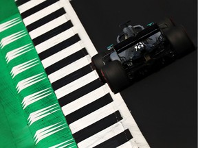 Championship leader Lewis Hamilton steers his Mercedes during Friday practice at his home British Grand Prix.