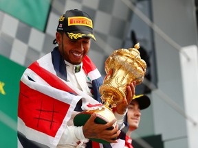 Race winner Lewis Hamilton of Great Britain and Mercedes GP celebrates on the podium during the F1 Grand Prix of Great Britain at Silverstone on July 14, 2019 in Northampton, England.