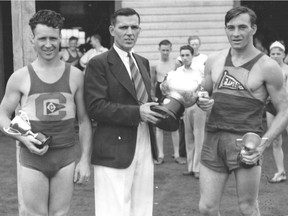 Pete Dunphy, commodore of the Grand Trunk Boat Club, presents the trophy for senior singles to Doug Bennett of the Excel Boat Club on July 29, 1939. Adam Kerr (left) of Cartierville was runner up.