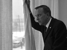 Yves Jasmin looks out his office window in January 1967. As head of information, publicity and public relations for Expo 67, Jasmin helped make the fair a success. He died last week at age 97.