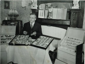John J. Lightstone is shown in his home with some of the watches in his collection.