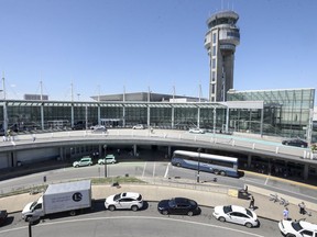 The control tower overlooks the international arrivals and departures wing at Trudeau airport in Dorval, west of Montreal on August 16, 2018.